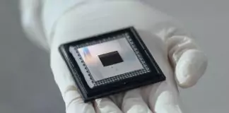 Google’s Willow Chip: A New Era of Quantum Computing A close-up of Google's Willow quantum computing chip held delicately in a gloved hand, symbolizing advanced technological innovation.