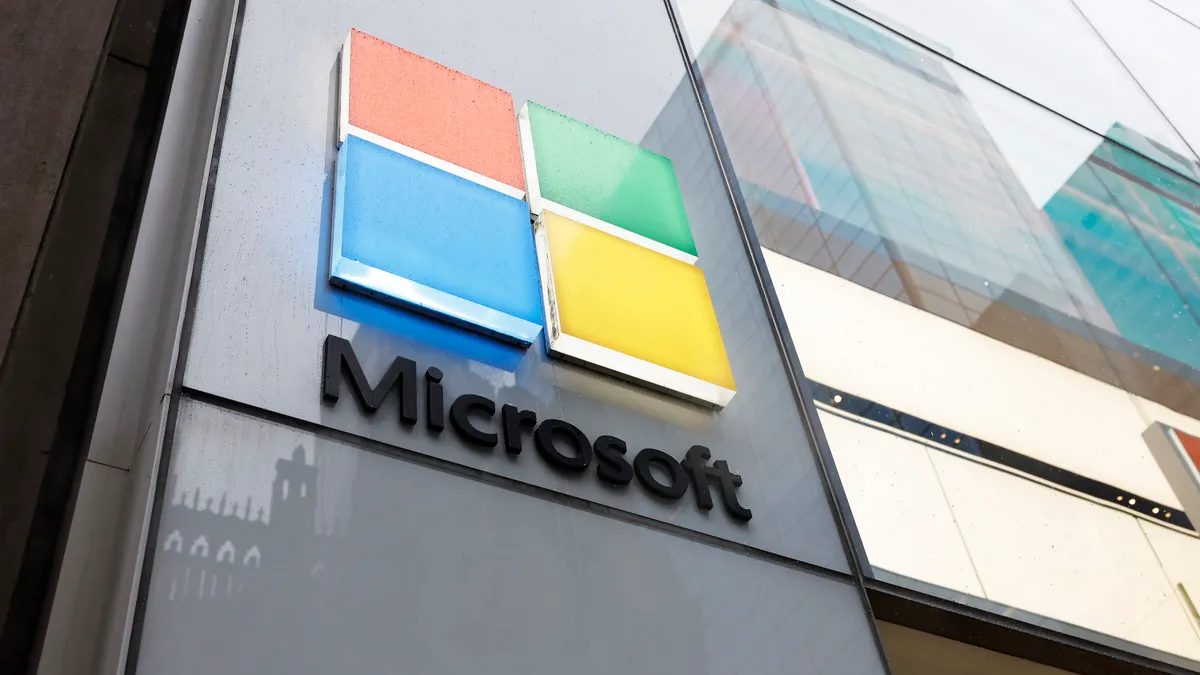 Microsoft Assails UK Markets Watchdog, Defends Software Licensing Microsoft logo at an Experience Center in New York City.